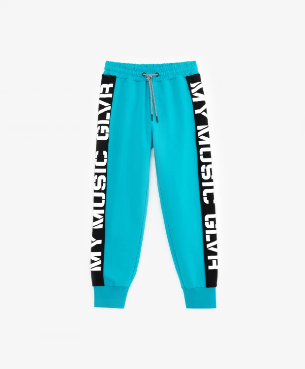 фото Брюки-джоггеры с лампасами и принтом бирюзовые gulliver (164)