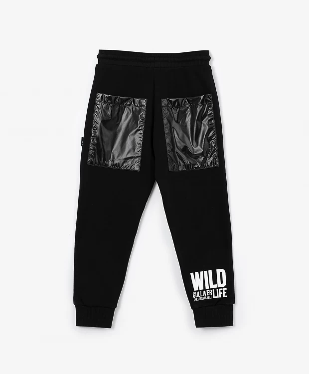 фото Брюки из футера с глянцевыми накладками черные gulliver (128)