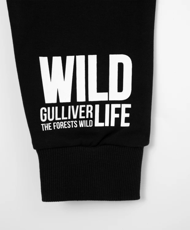 фото Брюки из футера с глянцевыми накладками черные gulliver (128)